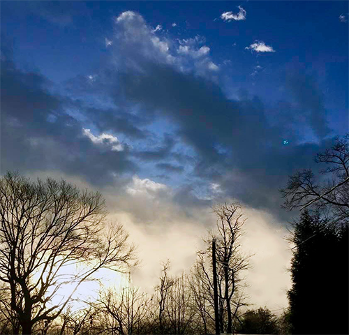 Sun Coming Up to Meet Low Hanging Fog in The Mountains of Western NC